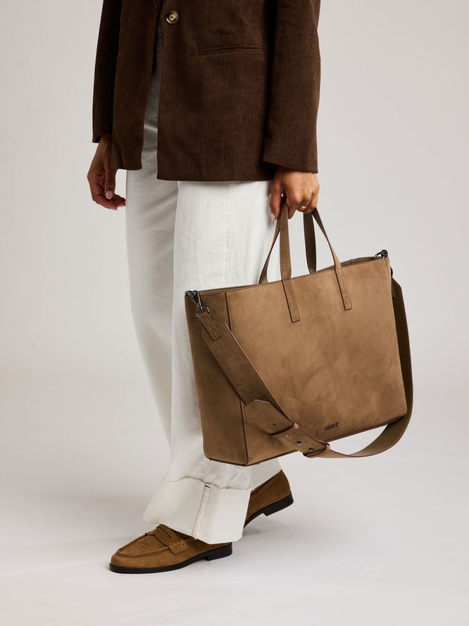 Model with the CALPAK Hue 16" Tote in Vegan Suede