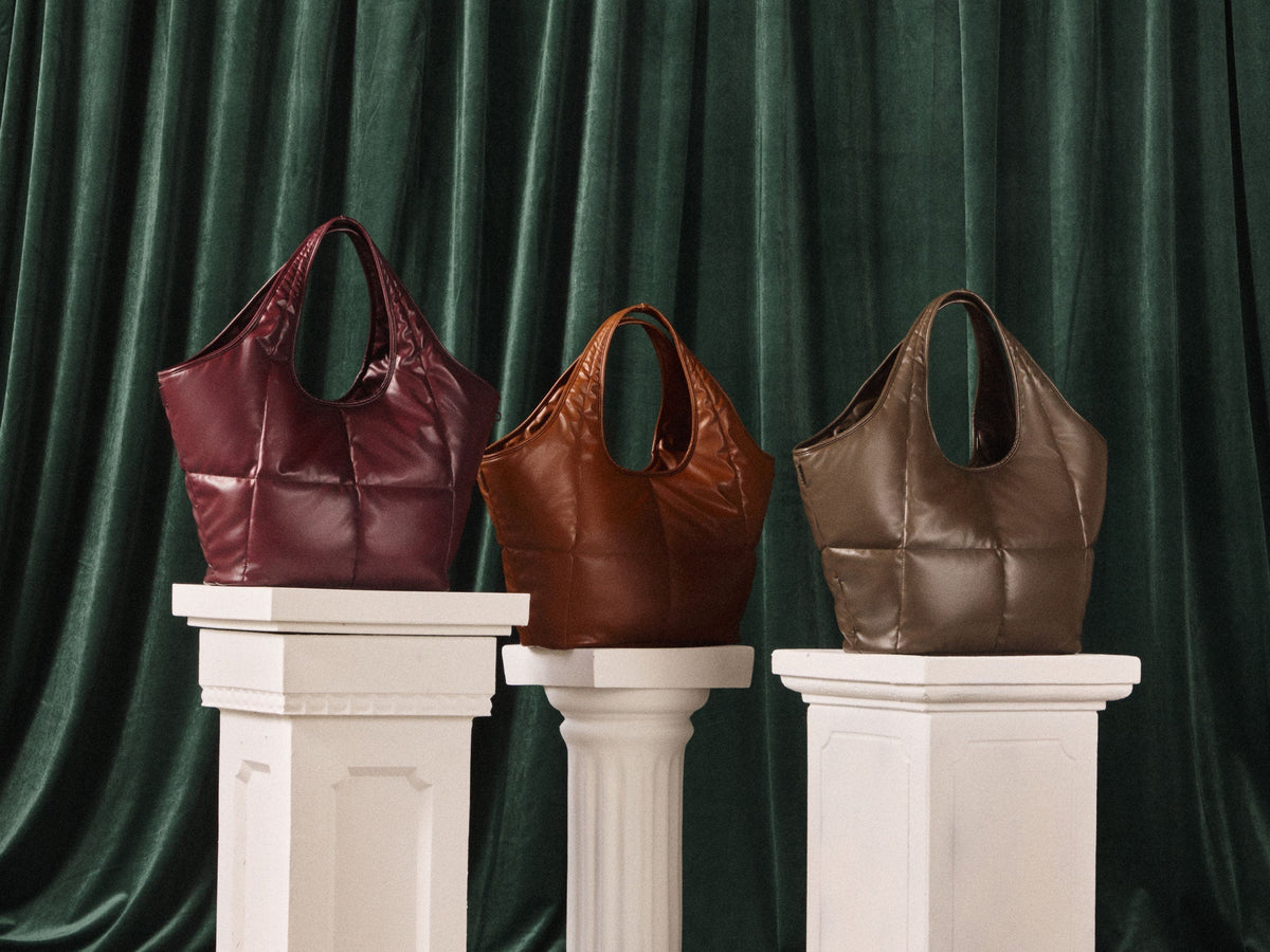 CALPAK Everything Tote Bags on white pedatsools