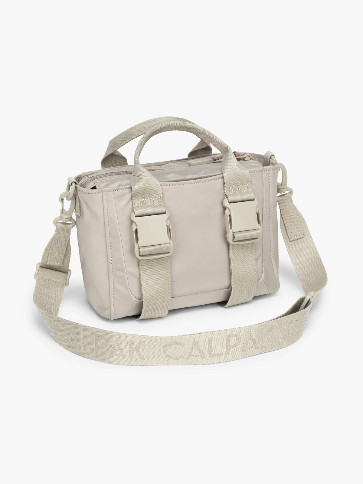 CALPAK Fit Gym Crossbody Bag in beige Greige side view with white background; ABF2601-GREIGE