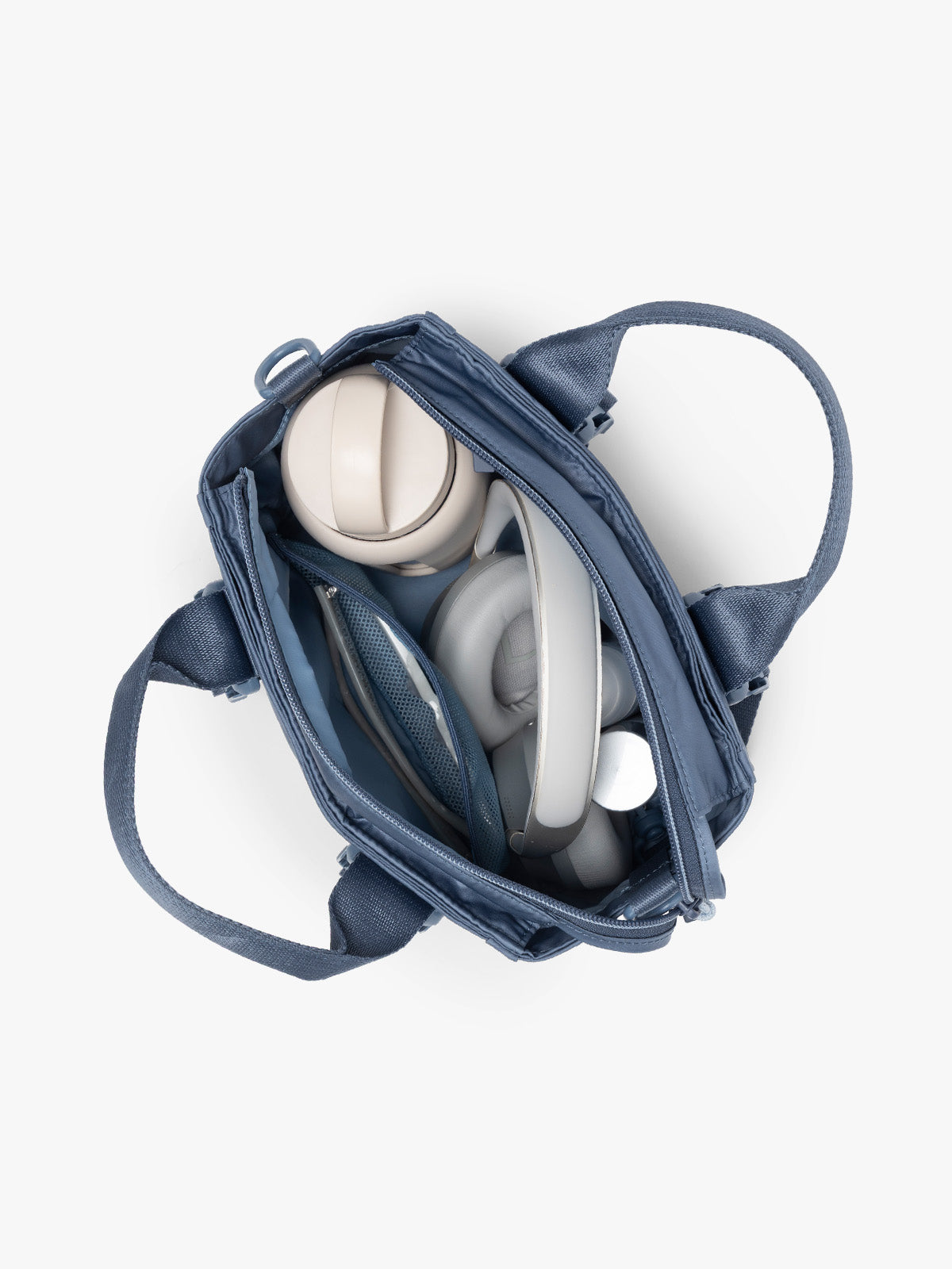 Inside of CALPAK Fit Gym Crossbody Bag in blue Indigo with white background; ABF2601-INDIGO