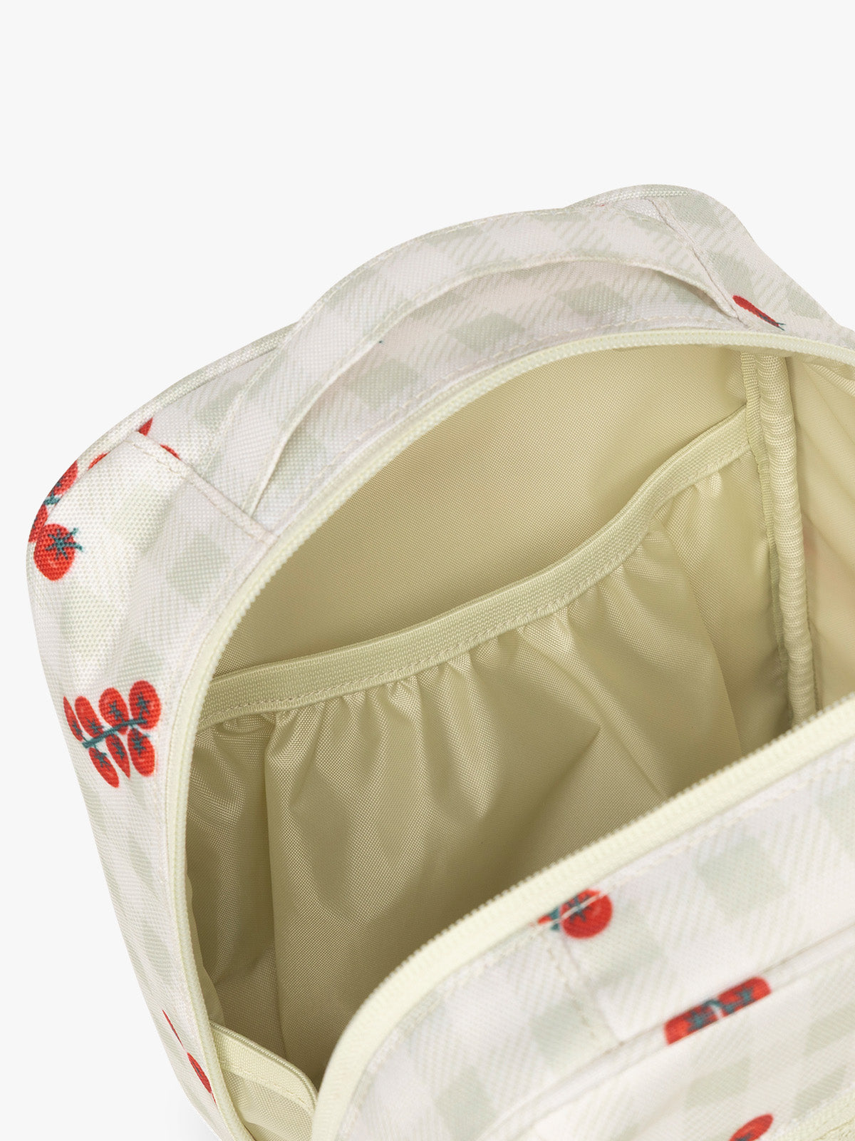 Pockets of CALPAK Everything Cube in light and green gingham pattern with tomato print; ACE2401-CELADON-TOMATO-PICNIC