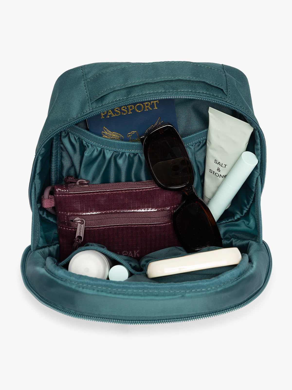 Inside of a dark teal green Kale CALPAK Everything Cube organizer with a top handle, a front zippered pocket, and a textured mesh lower panel, shown against a plain white background; ACE2401-KALE