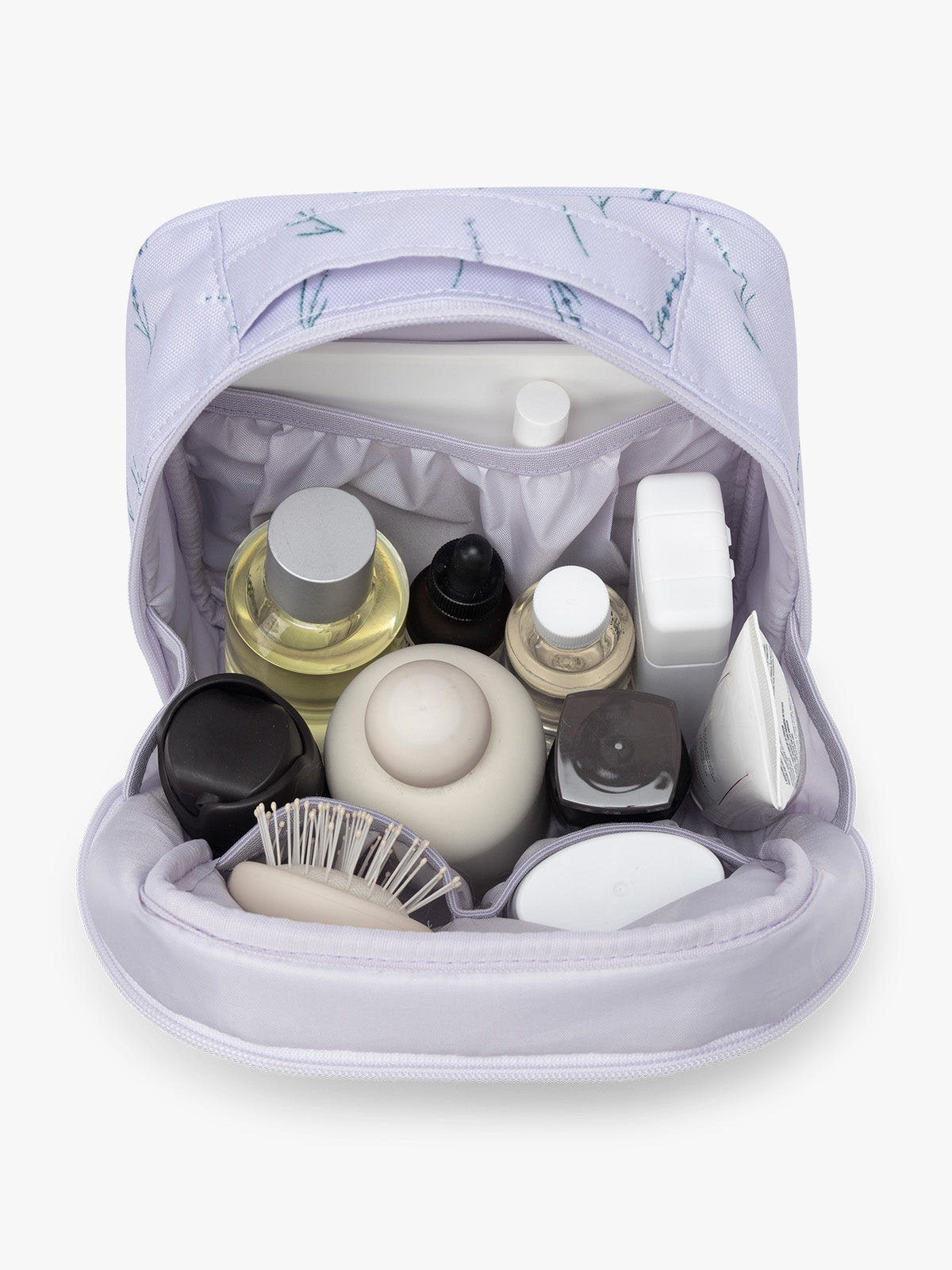 Products inside the CALPAK Everything Cube in light purple with lavender flower print ; ACE2401-LAVENDER-BLOOM