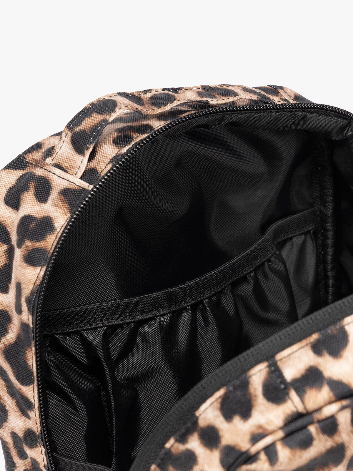 Close up of the compartments inside the Leopard print in Leopard the CALPAK Everything Cube organizer with a top handle, a front zippered pocket, and a textured mesh lower panel, shown against a plain white background; ACE2401-LEOPARD