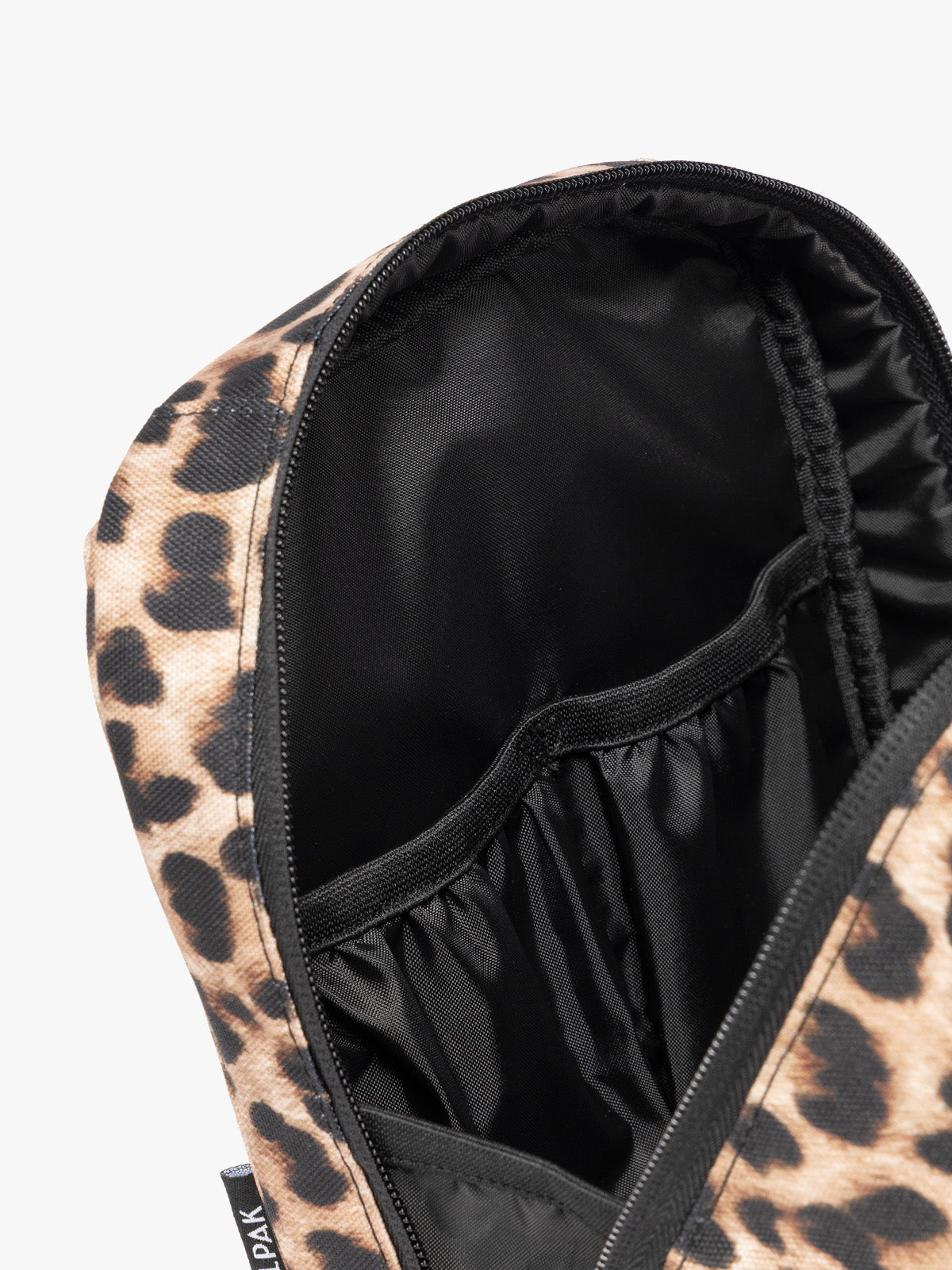 Close up of the compartments inside the Leopard print in Leopard the CALPAK Everything Cube organizer with a top handle, a front zippered pocket, and a textured mesh lower panel, shown against a plain white background; ACE2401-LEOPARD