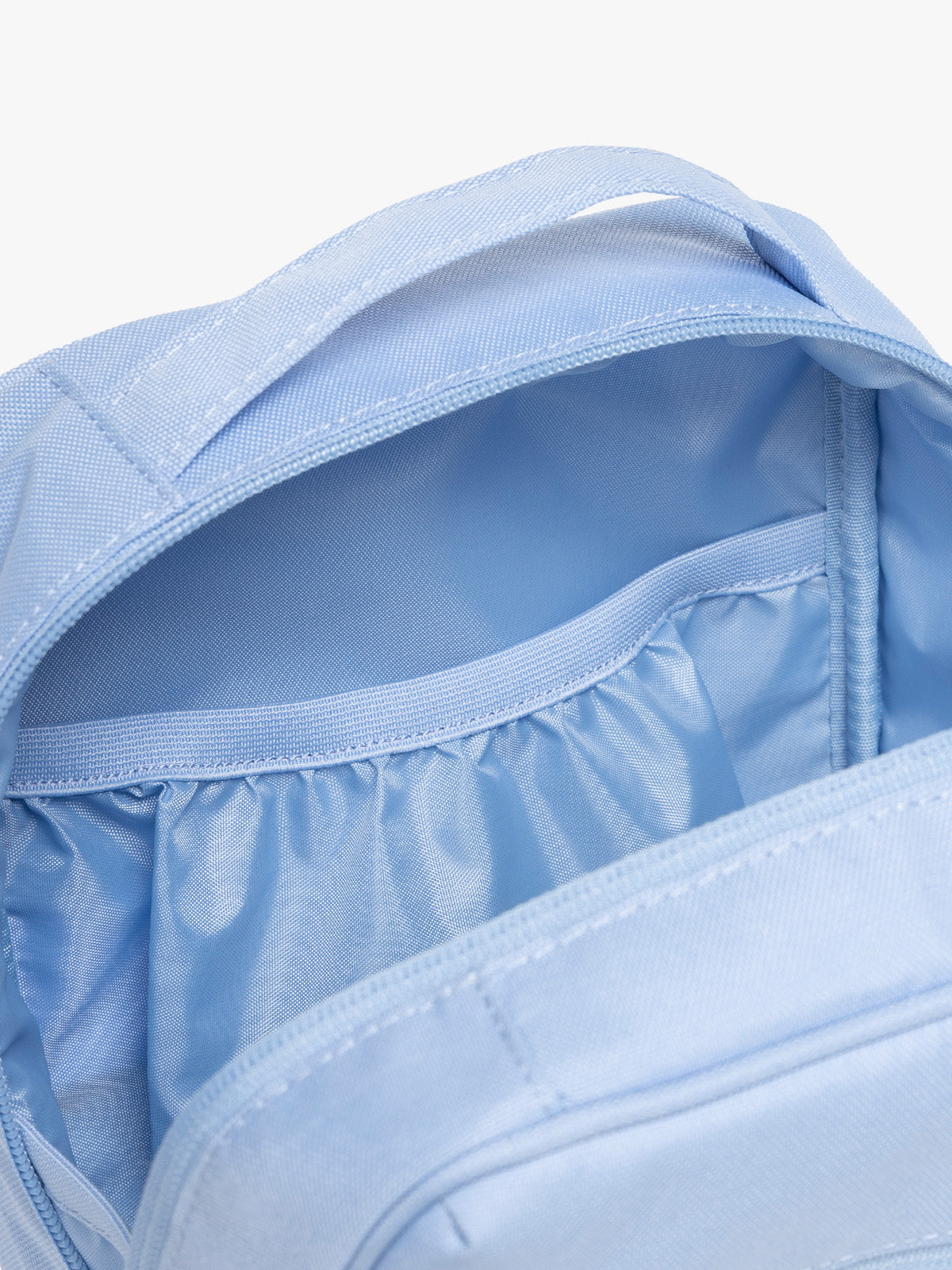Inside pocket of CALPAK Everything Cube in light blue SKY; ACE2401-SKY