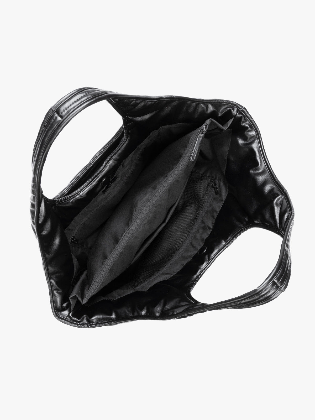 Top view showing inside of Black quilted puffer CALPAK Luka Everything Tote Bag with a smooth finish and double shoulder straps, shown against a plain white background; AET2601-BLACK-PU