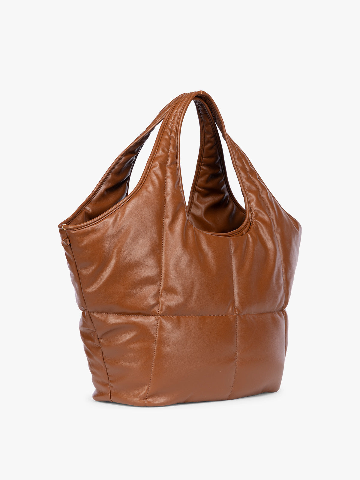 Side view of Honey Brown quilted puffer CALPAK Luka Everything Tote Bag with a smooth finish and double shoulder straps, shown against a plain white background; AET2601-HONEY-BROWN-PU