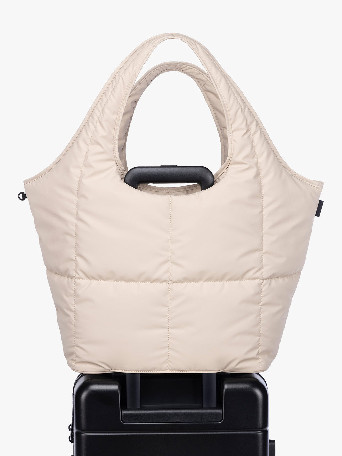 Luggage trolley sleeve of CALPAK Luka Everything Tote in off-white beige Oatmeal; AET2601-OATMEAL