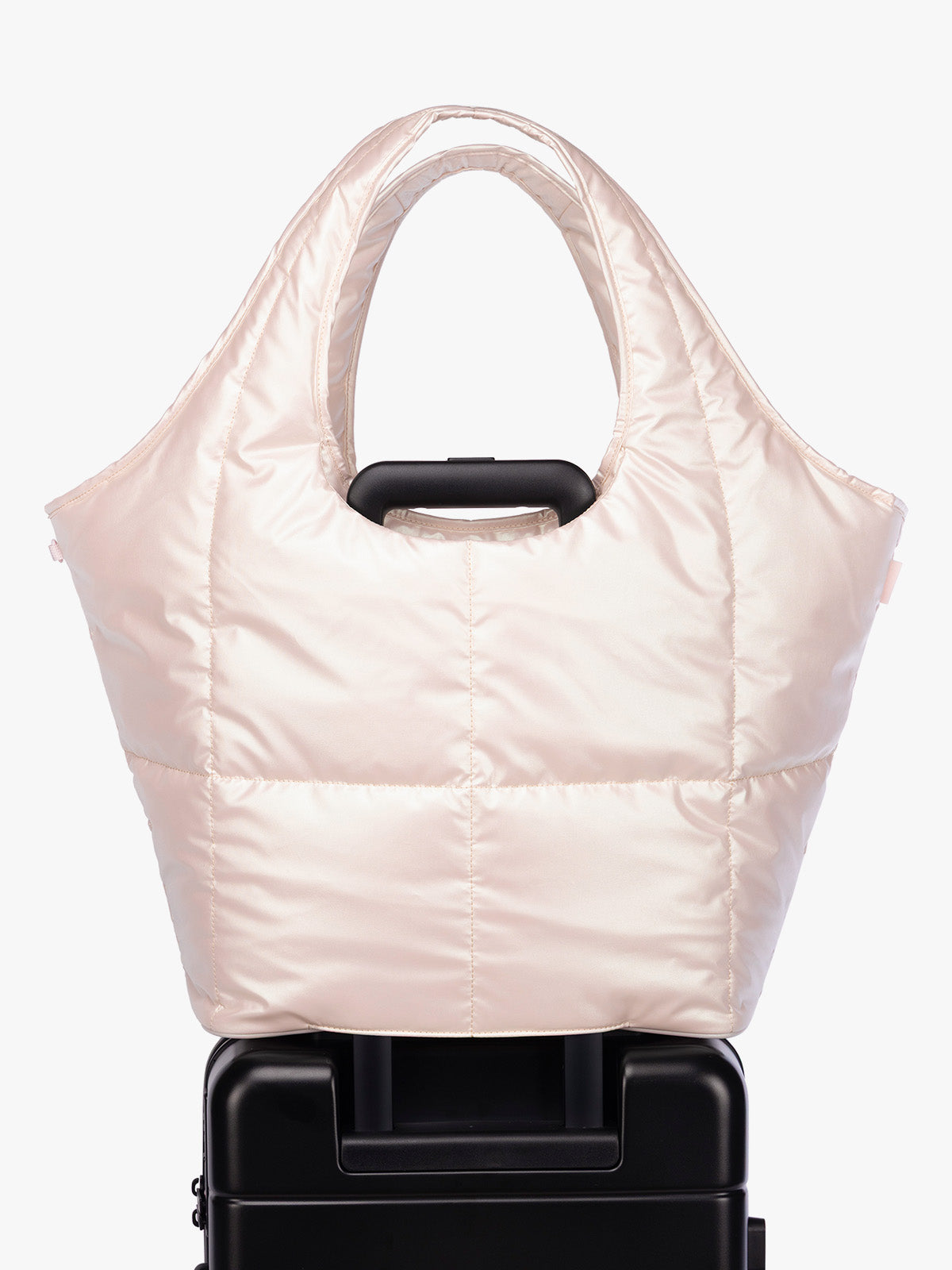 Luggage trolley sleeve of CALPAK Luka Everything Tote in light pink Pearlescent; AET2601-PEARLESCENT