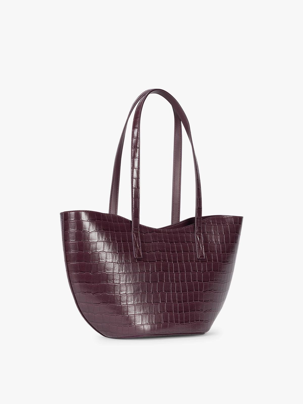 Side view of a CALPAK Haven Tulip Tote in Dark Cherry dark plum purple crocodile-embossed leather tote bag with double shoulder straps  against a plain white background ; AHP2601-DARK-CHERRY-FAUX-CROC