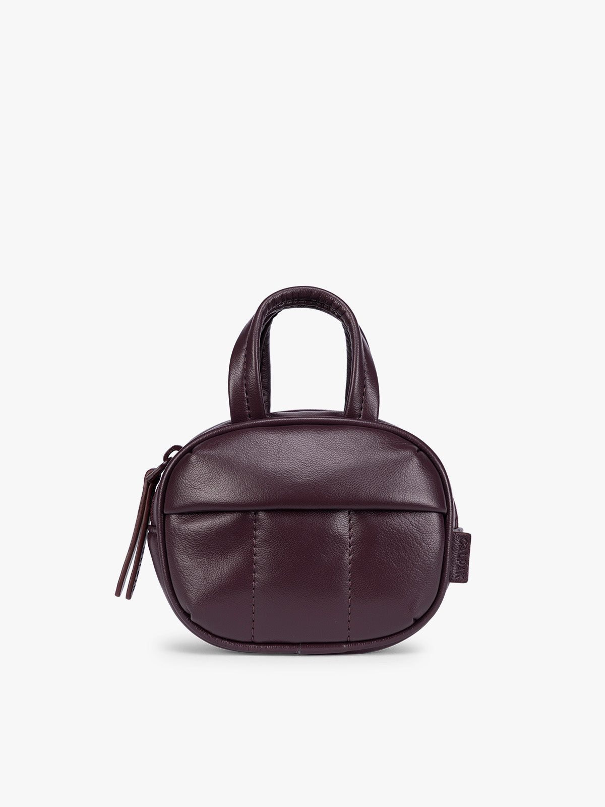 A deep burgundy Dark Cherry vegan leather top-handle CALPAK Luka Zip Bag Charm with a zippered front pocket and a small side strap, shown against a plain white background; ALK2501-DARK-CHERRY-PU