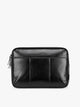 Black vegan leather CALPAK Luka 14in Laptop Sleeve with a zippered top and a front pocket, shown against a plain white background; ALL2401-BLACK-PU
