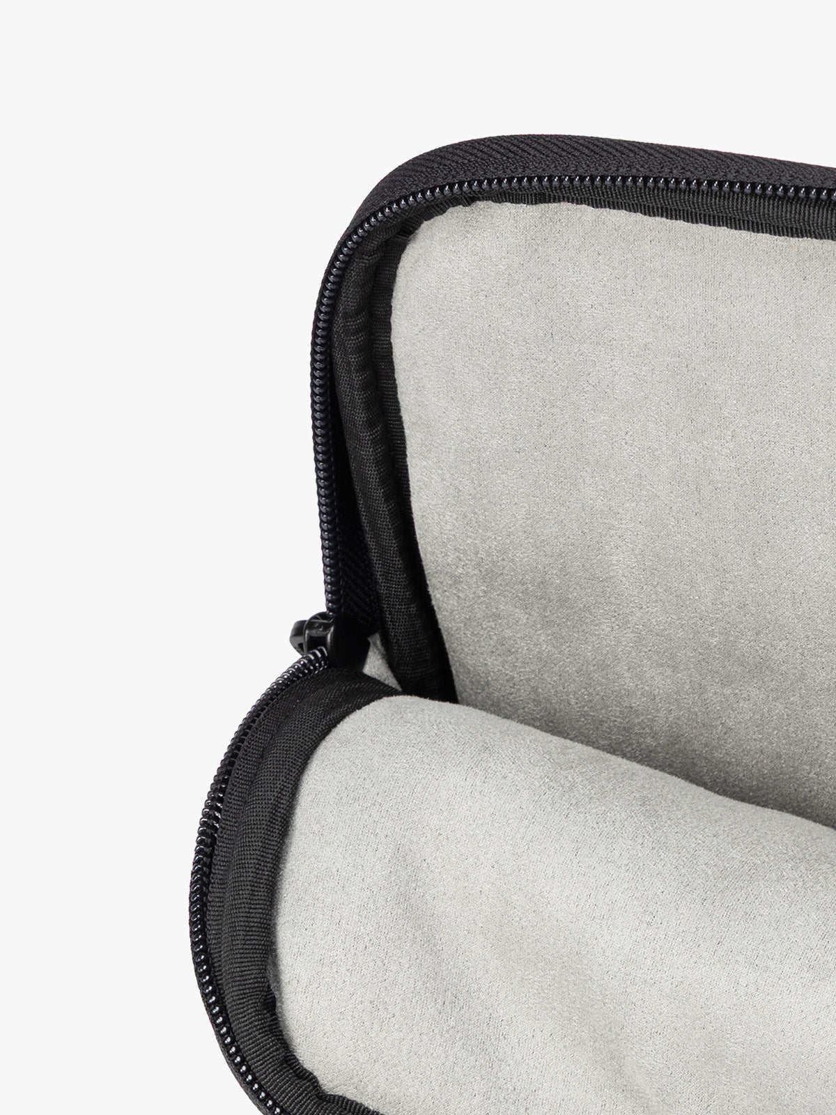 Interior of a black vegan leather CALPAK Luka 14in Laptop Sleeve with a zippered top and a front pocket, shown against a plain white background; ALL2401-BLACK-PU