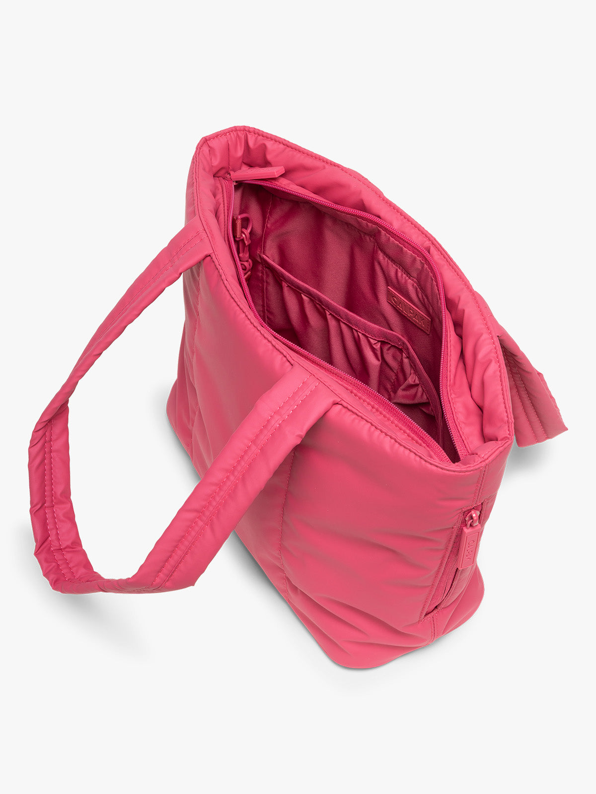 Opened view of CALPAK Luka Mini Tote in bright pink Dragonfruit on a white background; ALM2401-DRAGONFRUIT