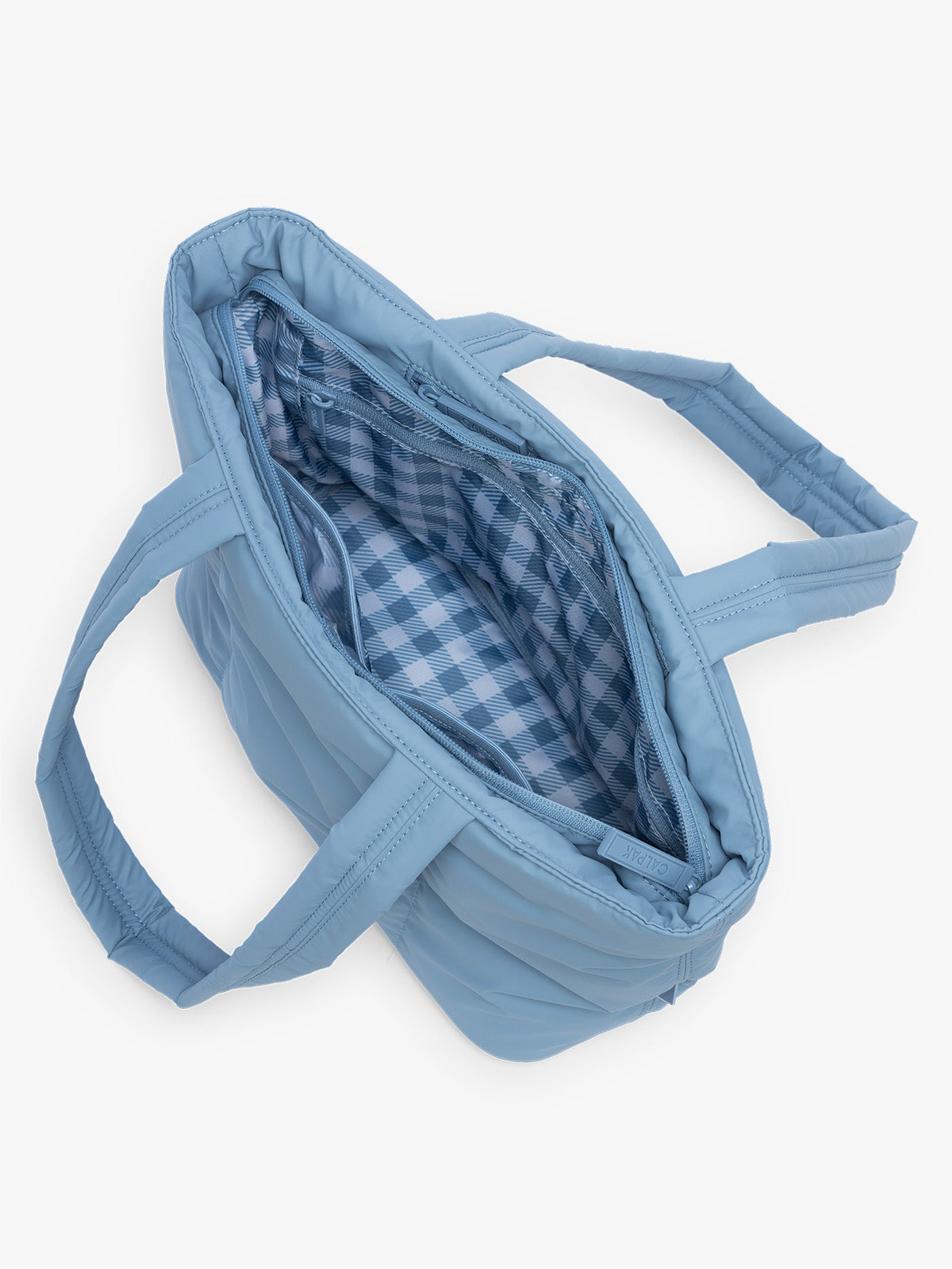 Opened CALPAK Luka Mini Tote in light blue French Blue with light blue and white gingham interior; ALM2401-FRENCH-BLUE
