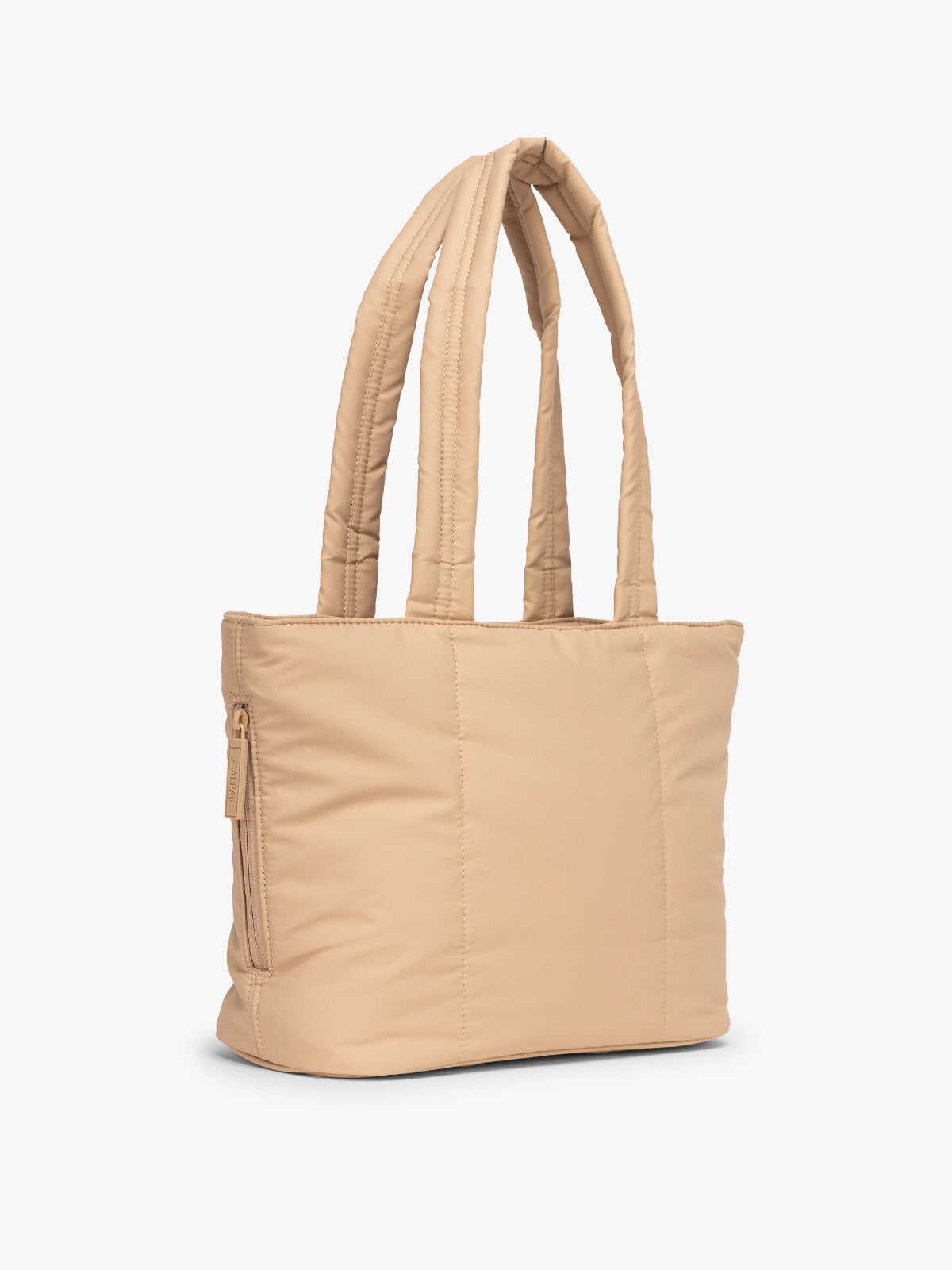 Side view of CALPAK Luka Mini Tote in beige Latte on a white background; ALM2401-LATTE