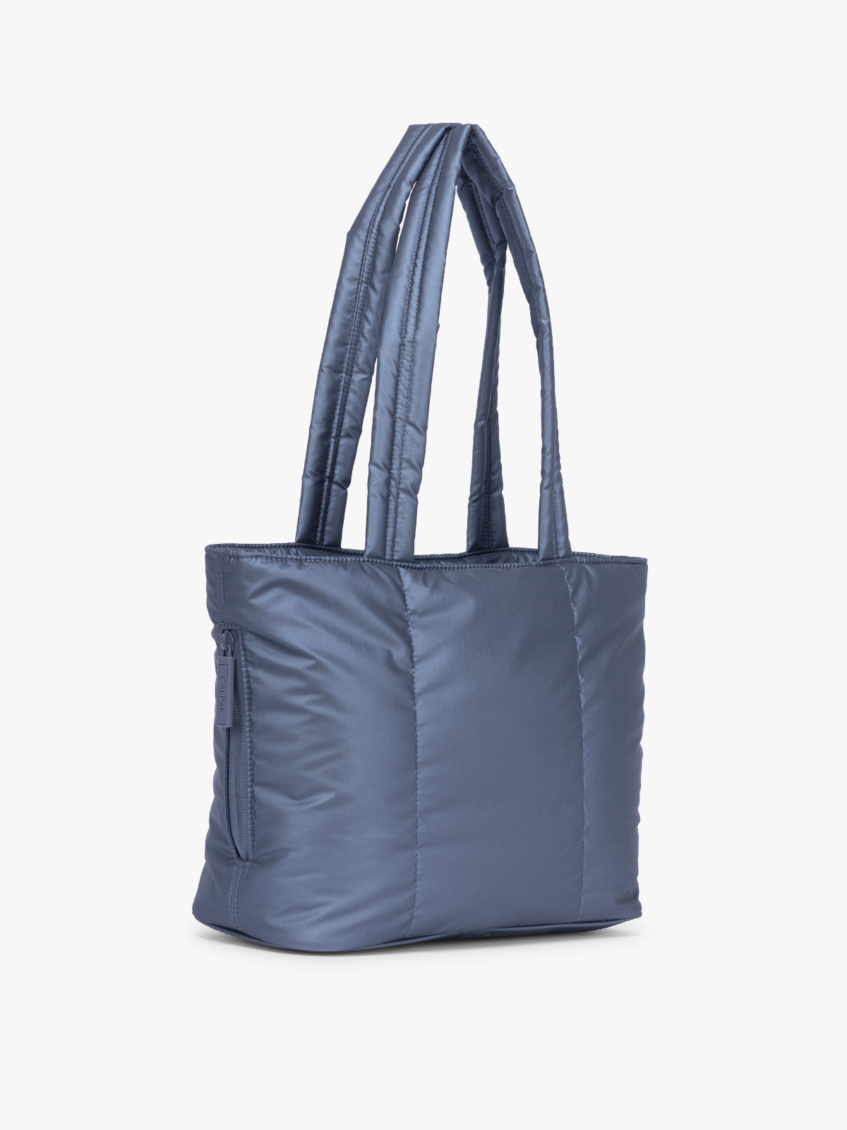 Side view of CALPAK Luka Mini Tote in metallic dark blue material in Metallic Indigo; ALM2401-METALLIC-INDIGO