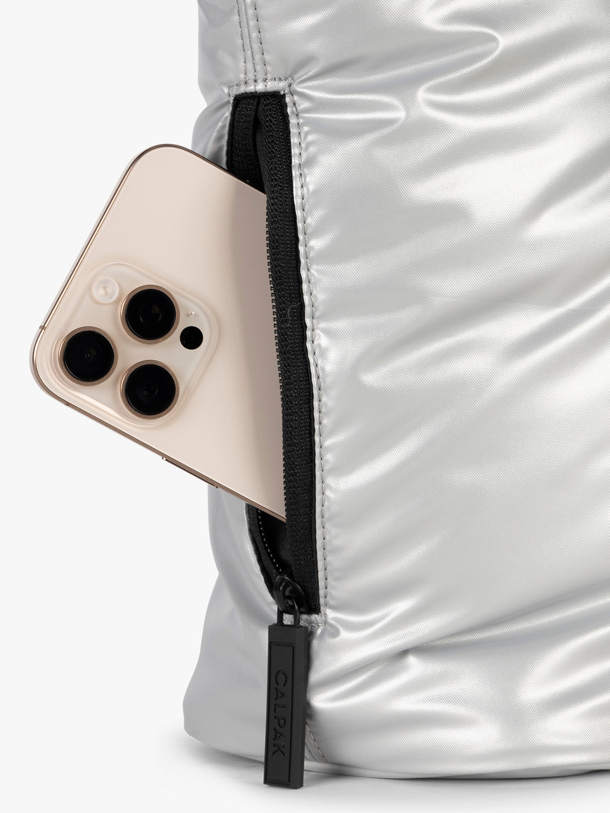 Side phone pocket view of CALPAK Luka Mini Tote in shiny Silver on a white background; ALM2401-SILVER