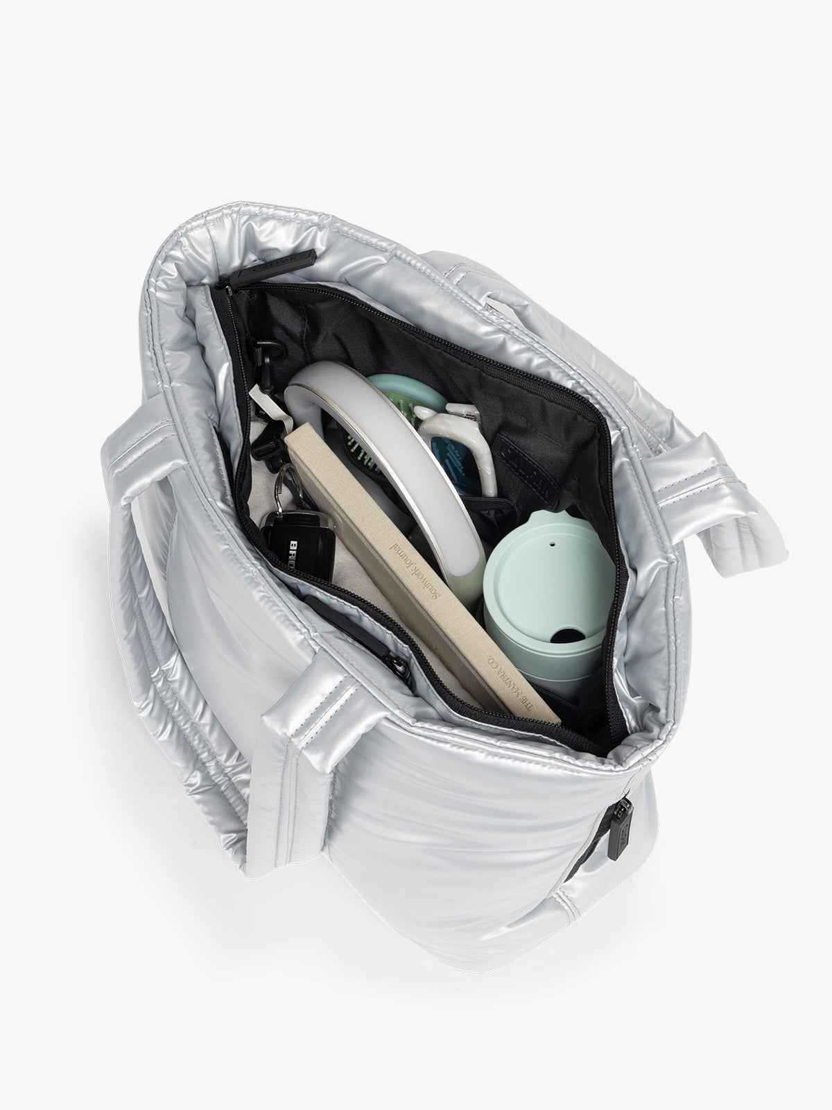 Opened view of CALPAK Luka Mini Tote in shiny Silver on a white background; ALM2401-SILVER