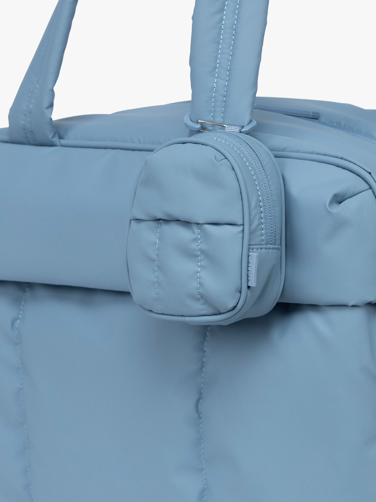 CALPAK Luka Backpack Zip Bag Charm in light blue French Blue clipped on bag ; AMB2201-FRENCH-BLUE