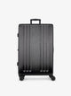 Studio product shot of front-facing CALPAK Ambeur large 30-inch black hardshell spinner luggage; LAM1028-BLACK