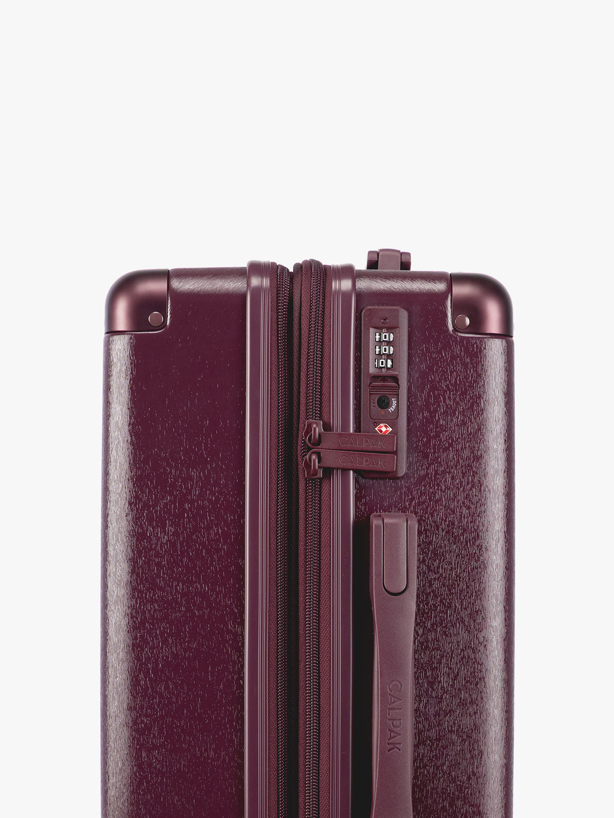 TSA Lock closeup of CALPAK Ambeur Three-Piece Set in dark burgundy Dark Cherry, featuring different sizes with telescoping handles extended, set against a plain light gray background; LAM3000-DARK-CHERRY
