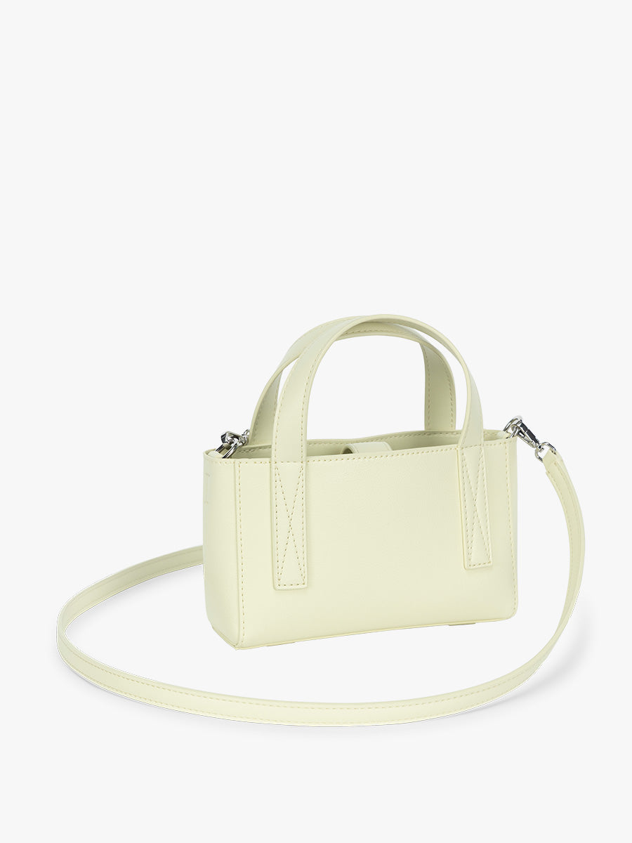 Side view of CALPAK Haven Mini Crossbody Bag in light green Celadon; AMC2501-CELADON