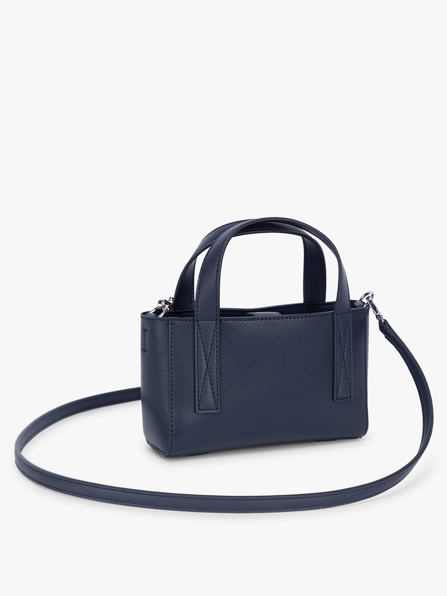 Side view of CALPAK Haven Mini Crossbody Bag in dark blue Navy; AMC2501-NAVY