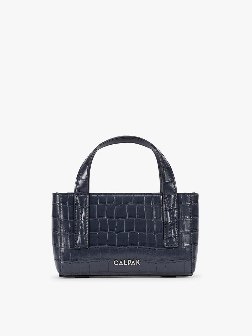 A CALPAK Haven Mini Crossbody Bag in Navy blue crocodile-embossed with top handles on a plain white background; AMC2502-NAVY-FAUX-CROC