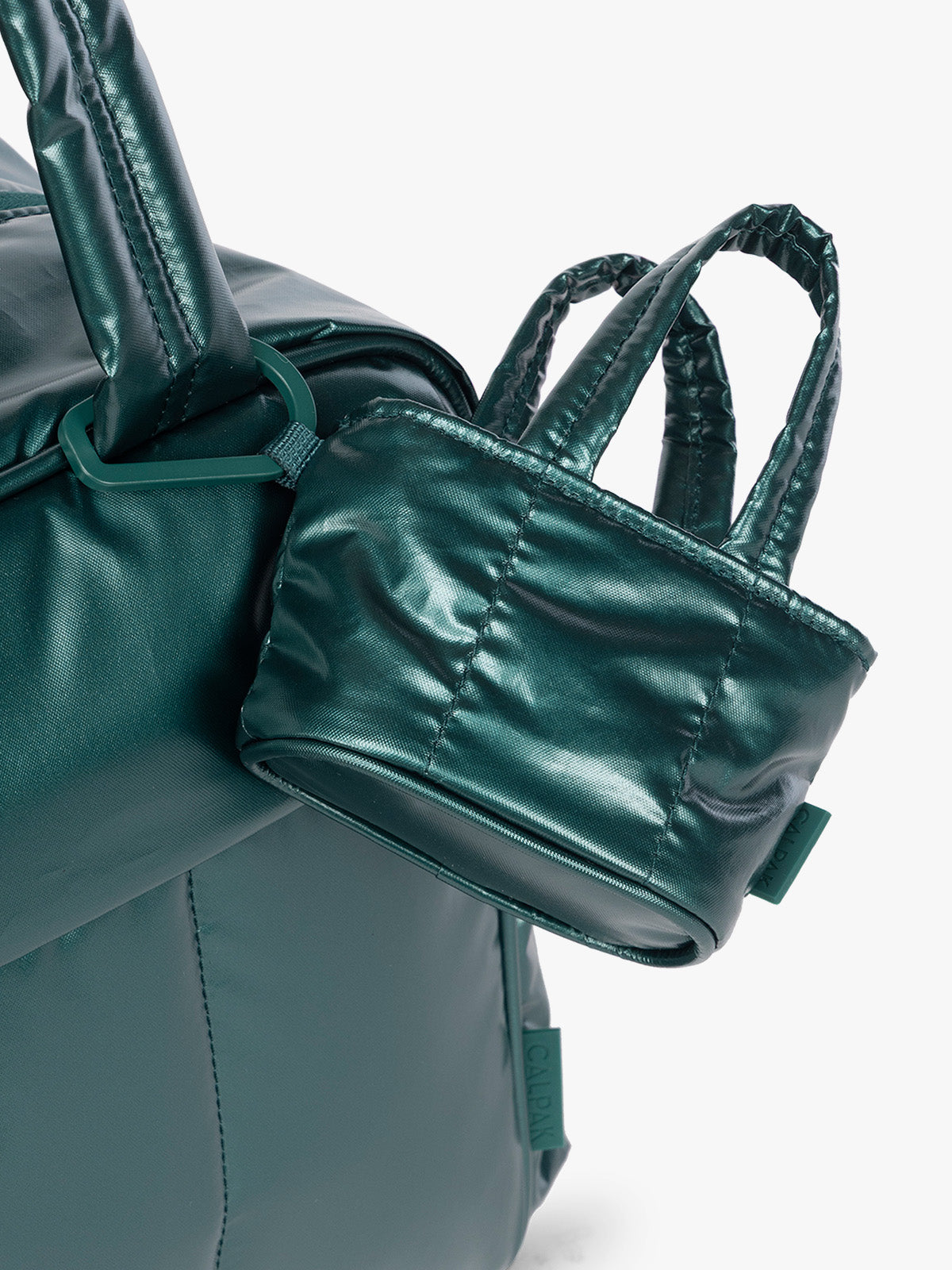 CALPAK Luka Tote Zip Bag Charm in dark green shiny Glazed Kale clipped on bag; AMT2601-GLAZED-KALE