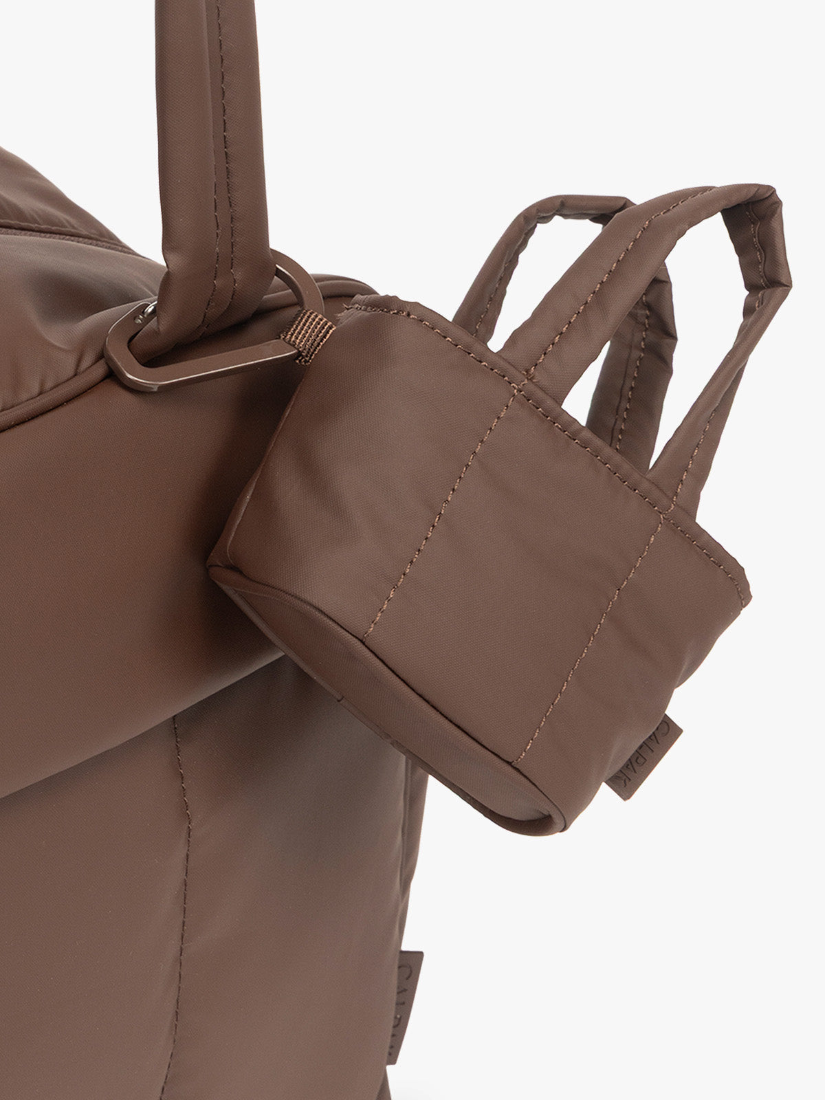 CALPAK Luka Tote Zip Bag Charm in brown Walnut with carabiner attached; AMT2601-WALNUT