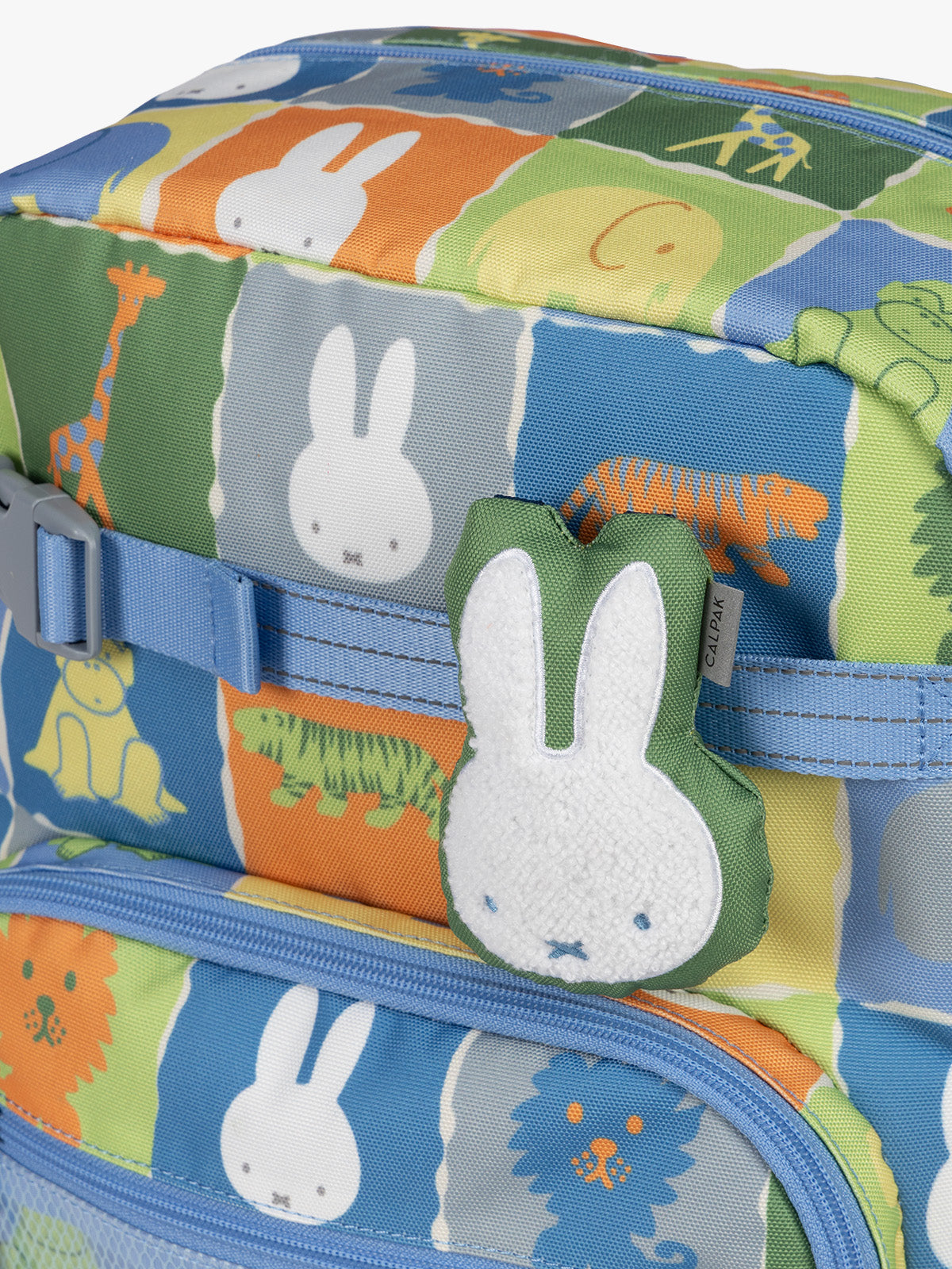Colorful CALPAK + Miffy Kids Essentials Set with children's Small backpack, lunch bag , pencil case set on a white background with blue accents and Miffy with other animals; BCKS5000-MIFFY-BLUE-ZOO-TRIP