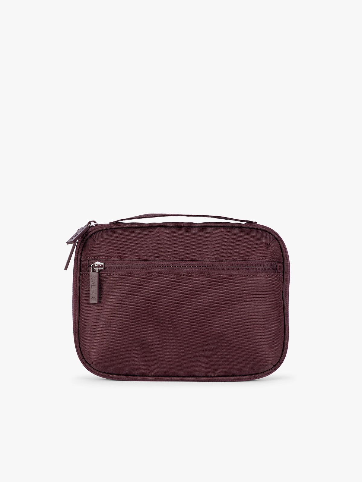 Backside of a dark burgundy CALPAK Tech Organizer pouch with a top zipper, front zippered pocket, and a small silver metal brand zipper, shown against a plain white background; ATC2001-DARK-CHERRY