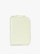 Front side of CALPAK Terra Zip Passport Wallet in light green Celadon; ATPW2501-CELADON