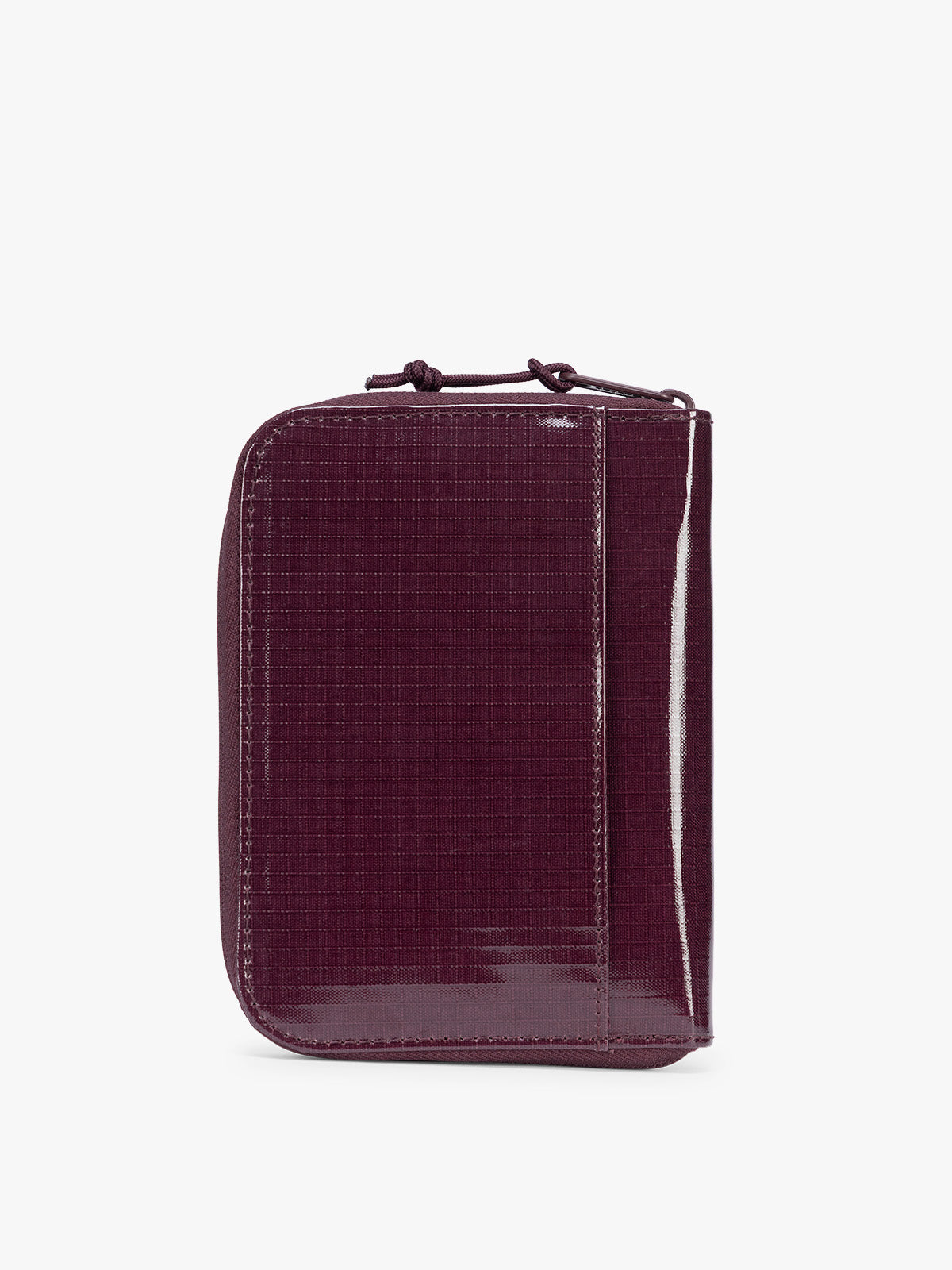 Back view of  CALPAK Terra Zip Passport Wallet in dark red Dark Cherry on a white background; ATPW2501-DARK-CHERRY