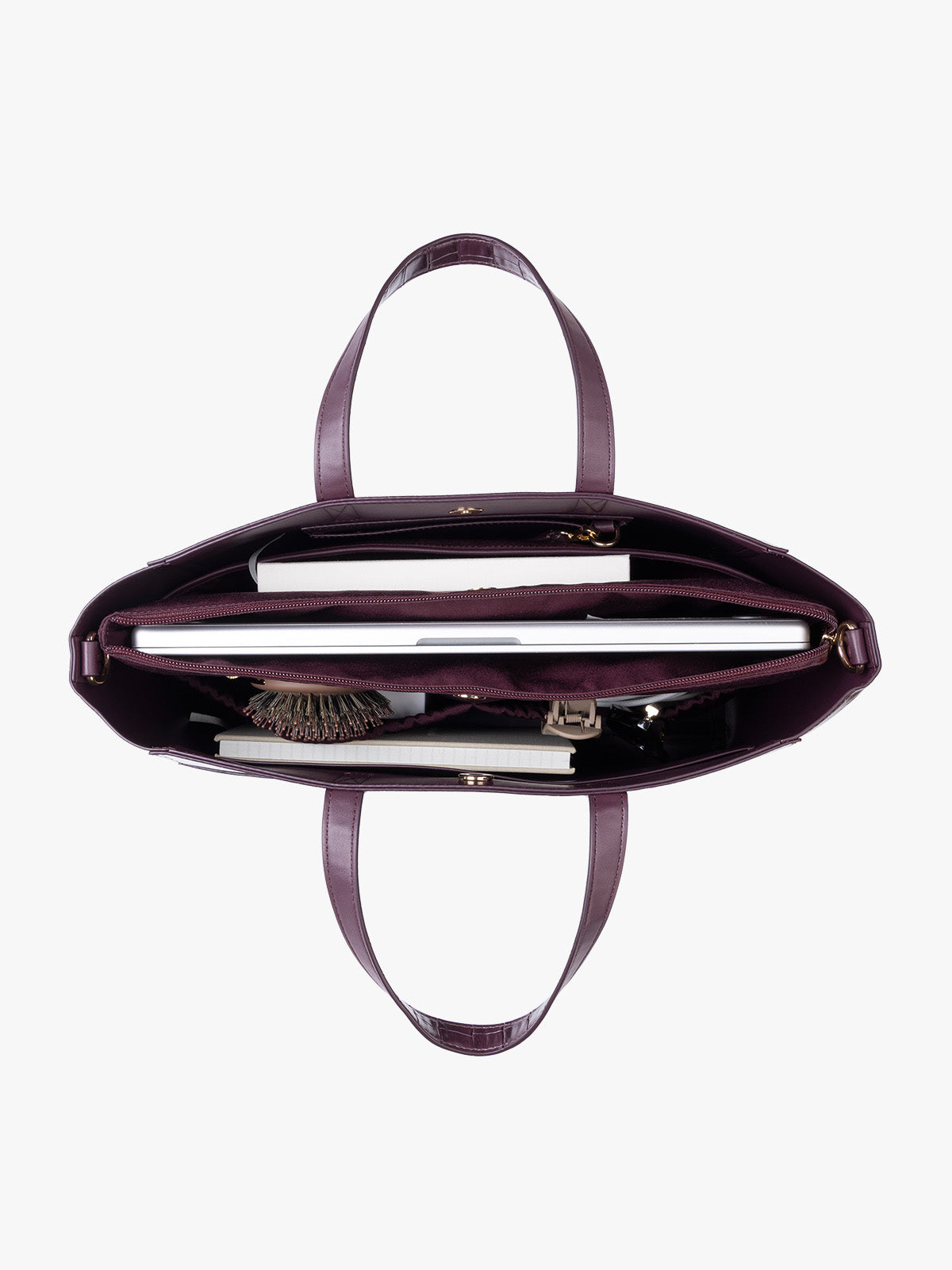 Items inside the CALPAK Haven 15" Laptop Tote in deep red Dark Cherry crocodile-embossed with dual top handles and a matching shoulder strap against a plain white background; ATS2501-DARK-CHERRY-FAUX-CROC