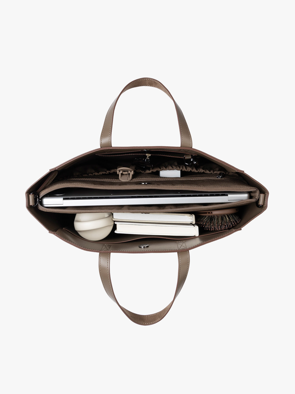 CALPAK Haven 15" Laptop Tote in Truffle Suede taupe with dual top handles and a matching shoulder strap with items inside against a plain white background; ATS2501-TRUFFLE-FAUX-SUEDE