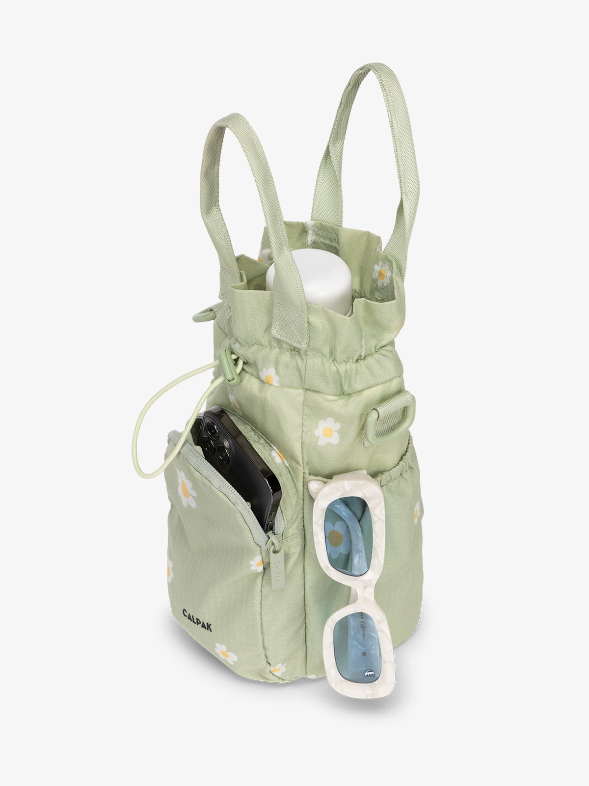 water bottle bag in green with daisy print holding phone and sunglasses; AWH2101-DAISY