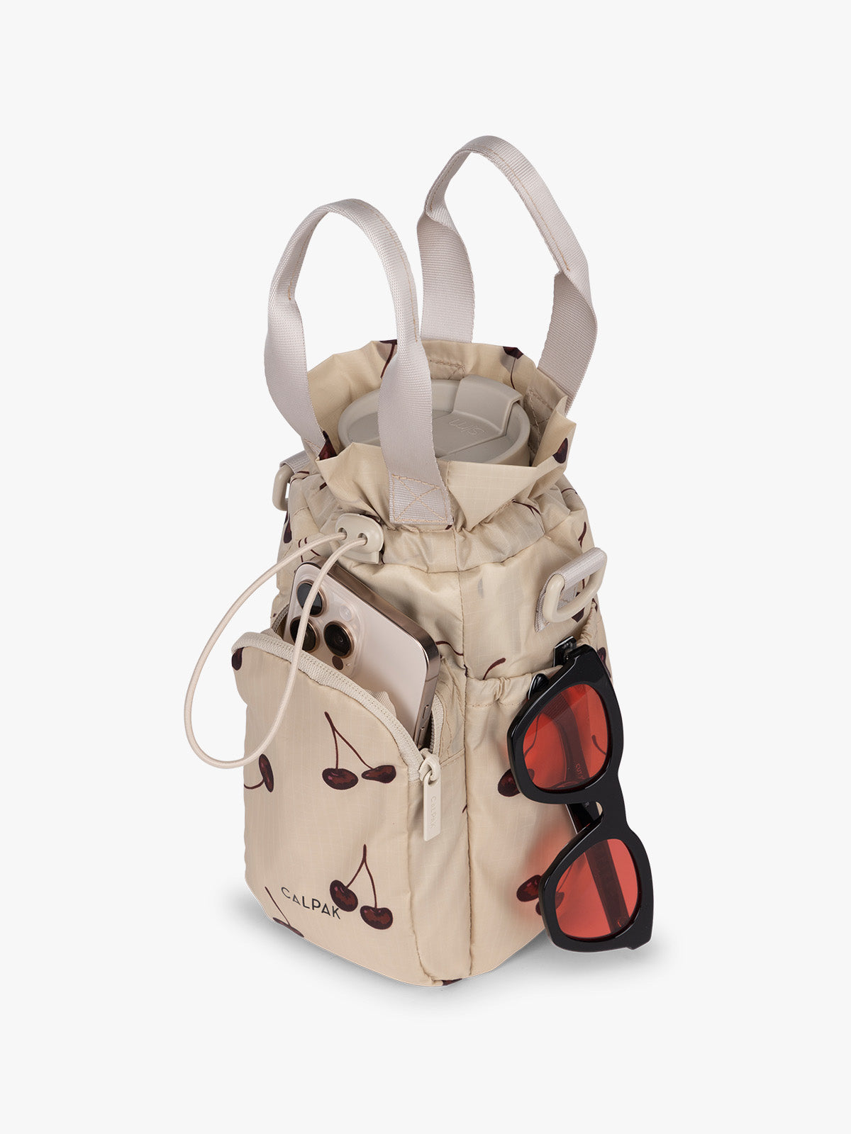 Water bottle in CALPAK Water Bottle Holder in Oatmeal Chery in beige with cherry pattern; AWH2101-OATMEAL-CHERRY