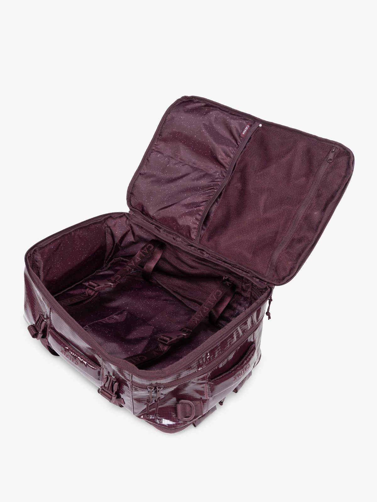 Opened CALPAK Terra 26L Laptop Backpack in dark red Dark Cherry with multiple pockets on a white background; BPH2201-DARK-CHERRY