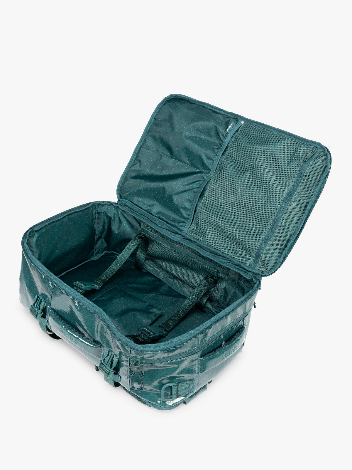 Opened CALPAK Terra 26L Laptop Backpack in dark blue green Kale with multiple pockets on a white background; BPH2201-KALE
