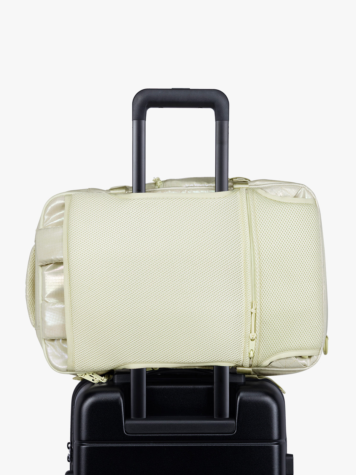 Luggage trolley sleeve of CALPAK Terra 26L Laptop Duffel Backpack with multiple pockets in shiny white Moonbeam on a white background; BPH2201-MOONBEAM