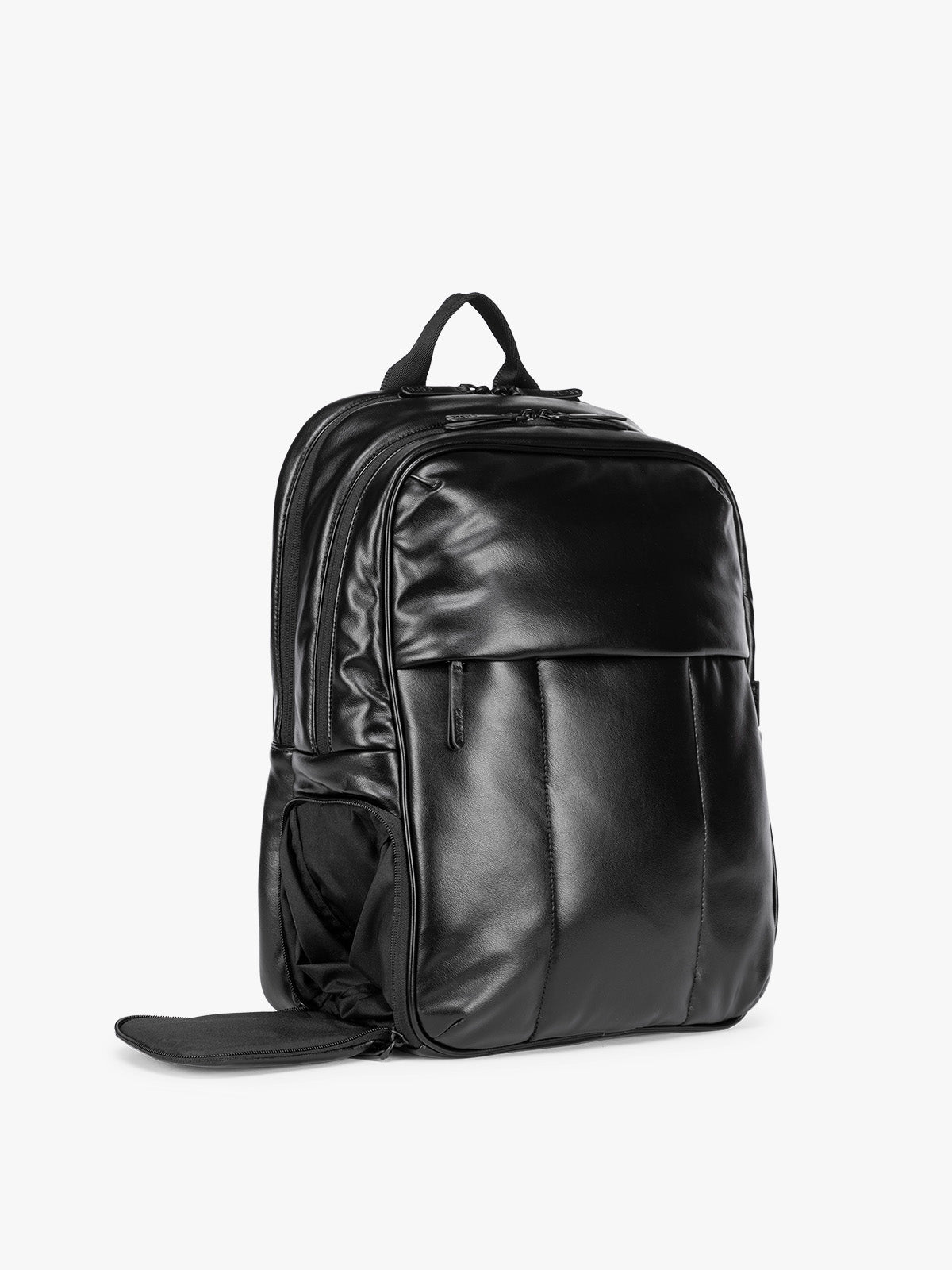 Side shoe compartment of Black CALPAK Luka 15 inch Laptop Backpack in vegan leather with a glossy finish, featuring a top carry handle, a main zippered compartment, and a front slip pocket, shown against a plain white background; BPL2001-BLACK-PU