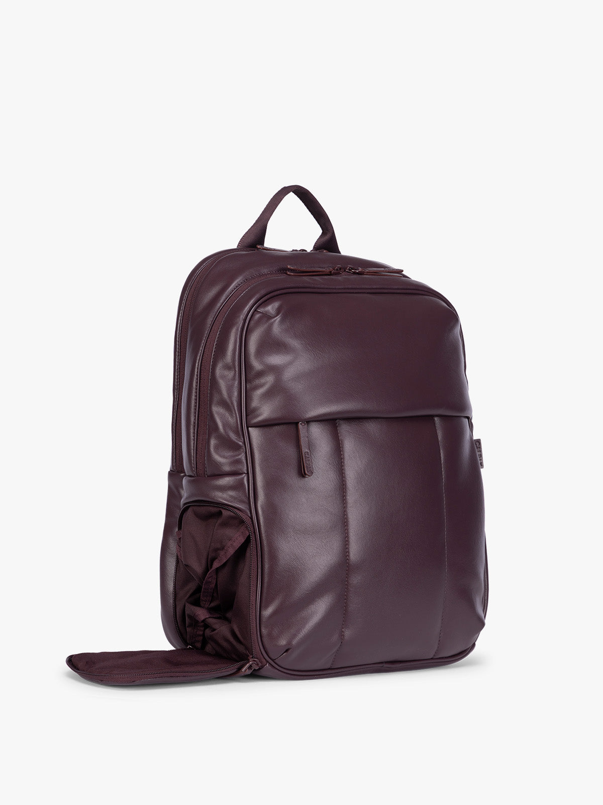Side compartment of CALPAK Dark Cherry Luka 15 inch Laptop Backpack in vegan leather with a glossy finish, featuring a top carry handle, a main zippered compartment, and a front slip pocket, shown against a plain white background; BPL2001-DARK-CHERRY-PU