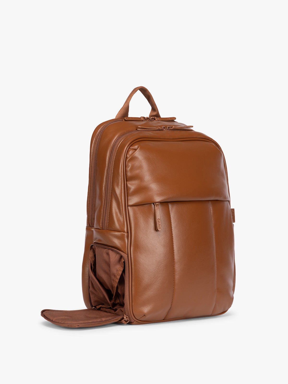 Side shoe compartment of CALPAK Honey Brown Luka 15 inch Laptop Backpack in vegan leather with a glossy finish, featuring a top carry handle, a main zippered compartment, and a front slip pocket, shown against a plain white background; BPL2001-HONEY-BROWN-PU