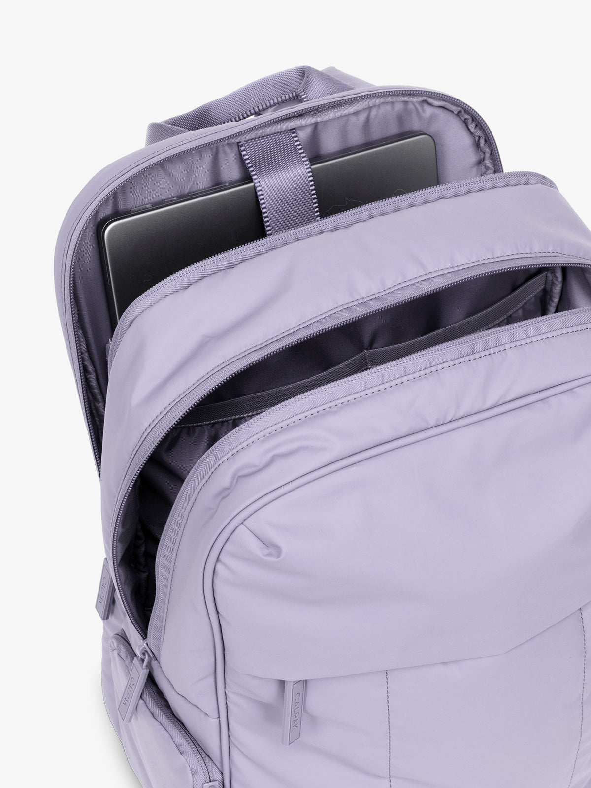 CALPAK Luka 15 inch Laptop Backpack opened and showing laptop sleeve in lavender purple in Orchid; BPL2001-ORCHID