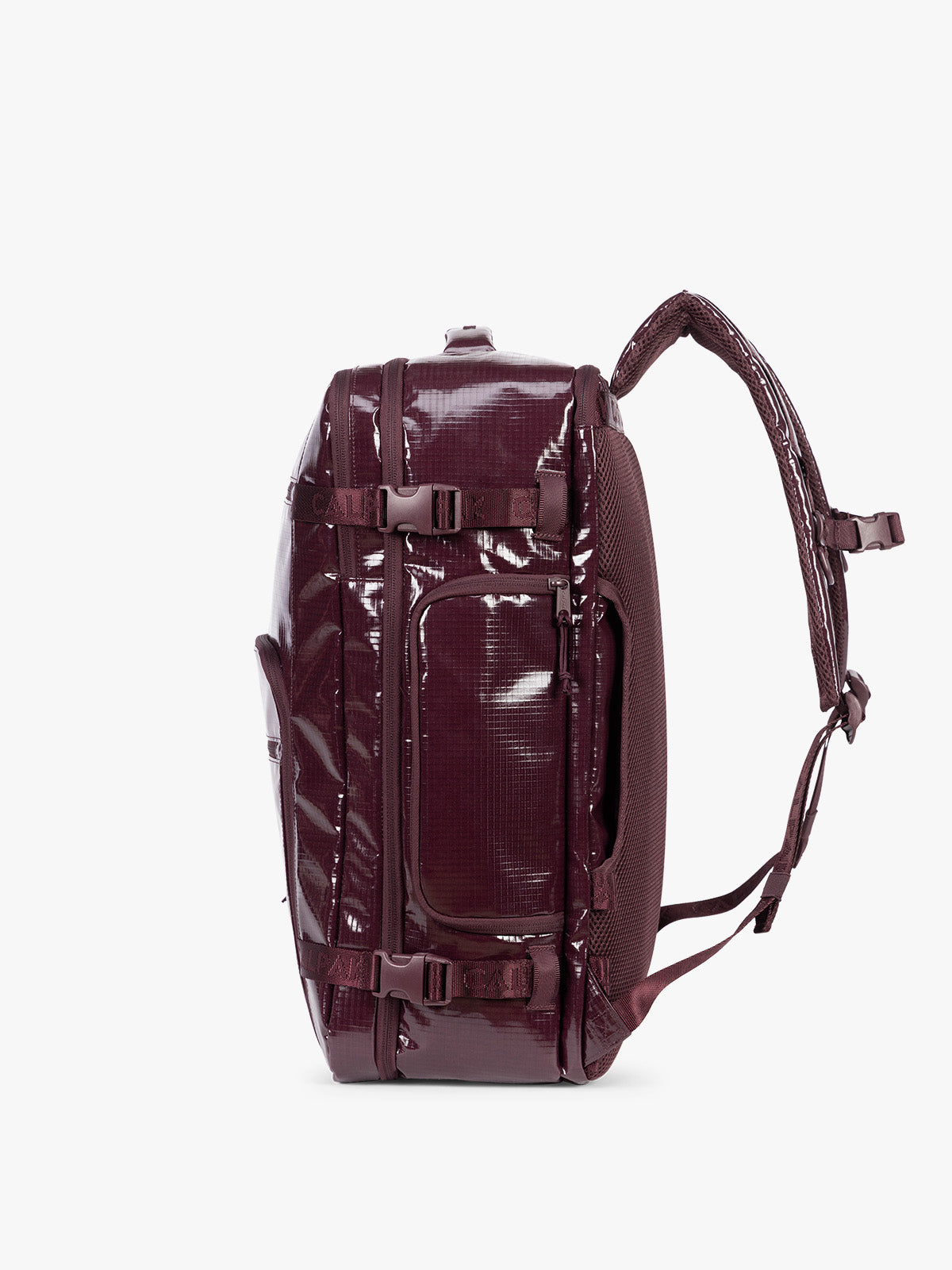 Side view of CALPAK Terra 35L Laptop Backpack Duffel in dark red Dark Cherry with tan accents on a white background; BPTL2601-DARK-CHERRY
