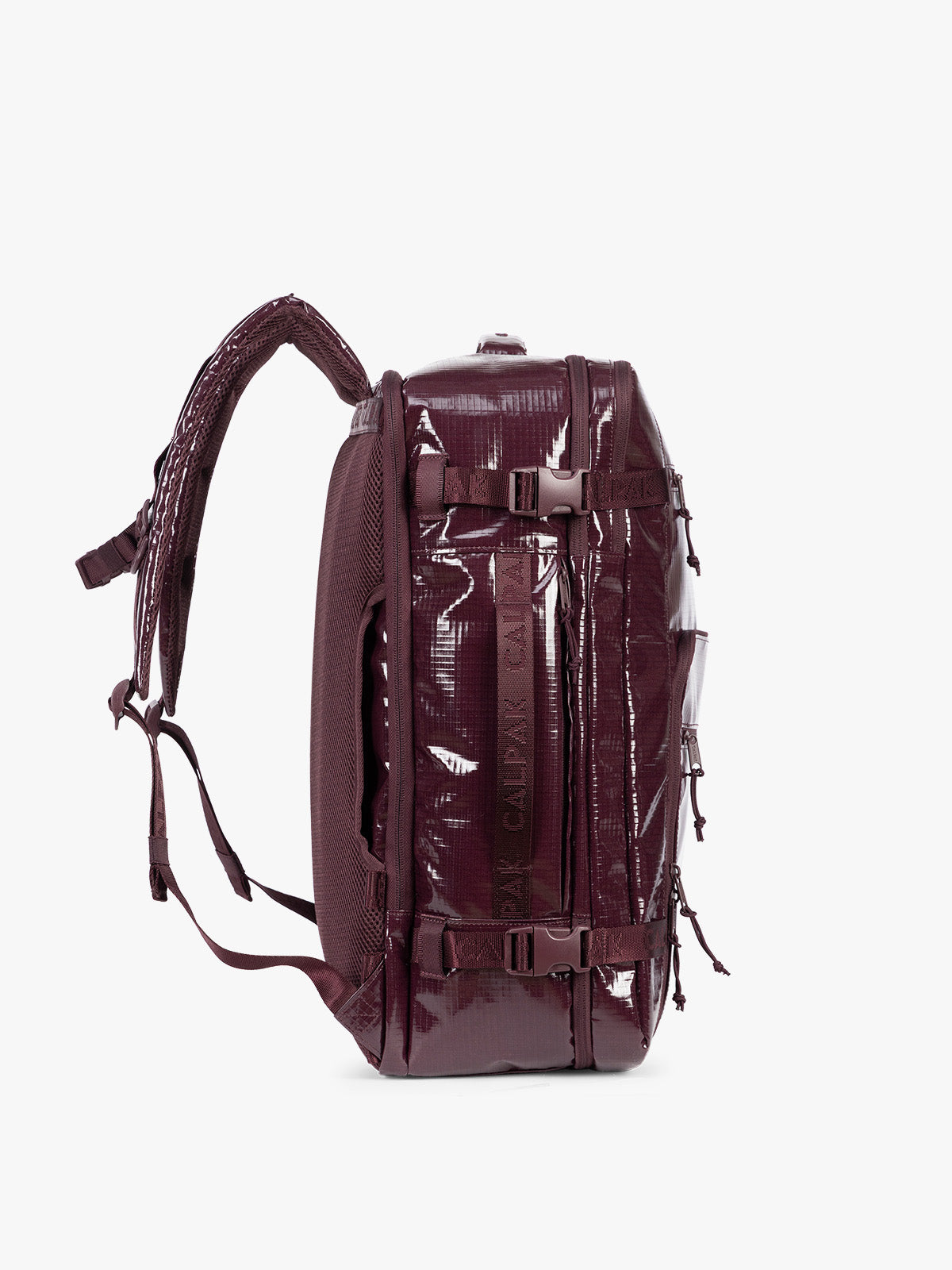 Side view of CALPAK Terra 35L Laptop Backpack Duffel in dark red Dark Cherry with tan accents on a white background; BPTL2601-DARK-CHERRY