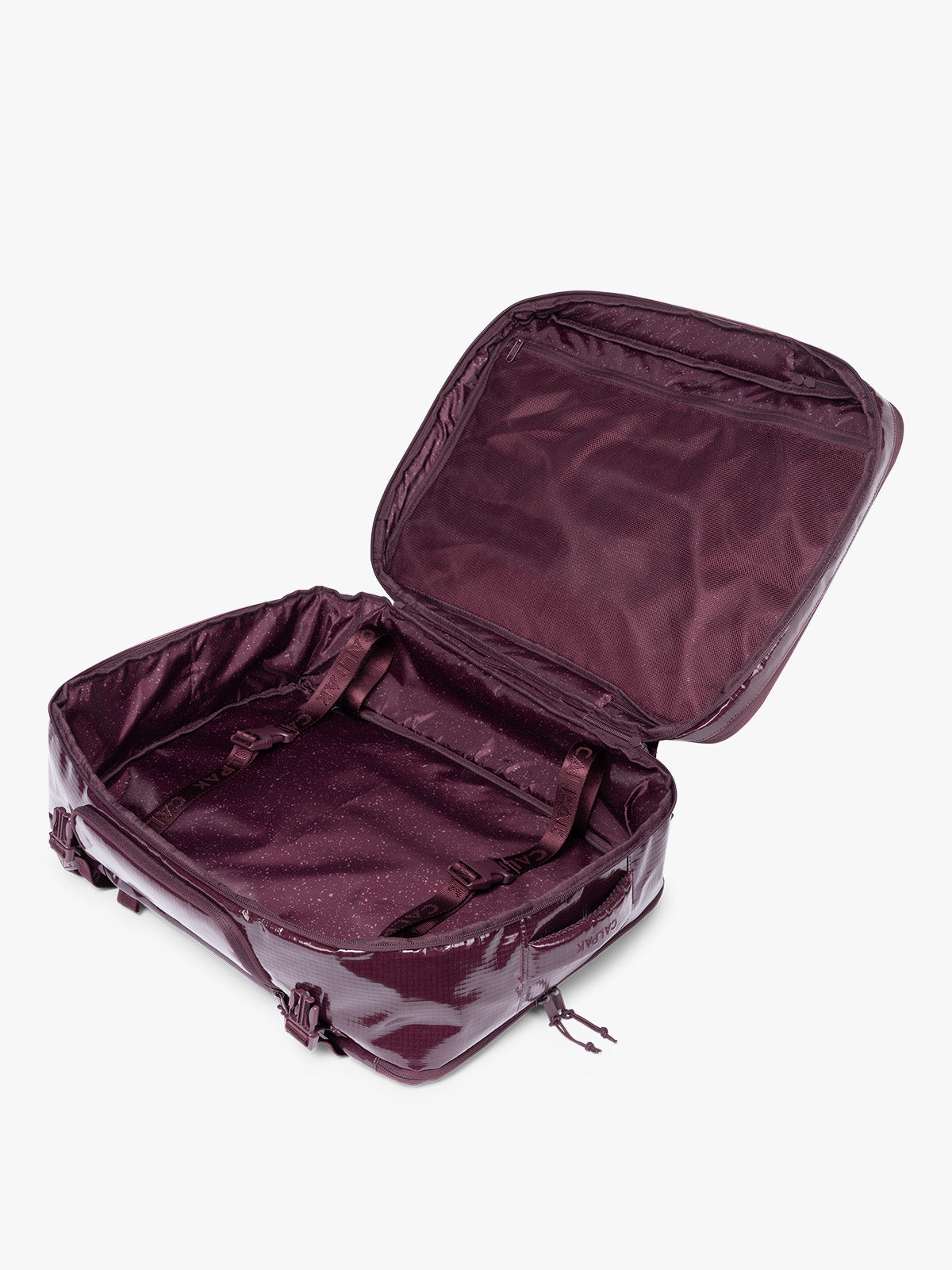 Opened CALPAK Terra 35L Laptop Backpack Duffel in dark red Dark Cherry with tan accents on a white background; BPTL2601-DARK-CHERRY